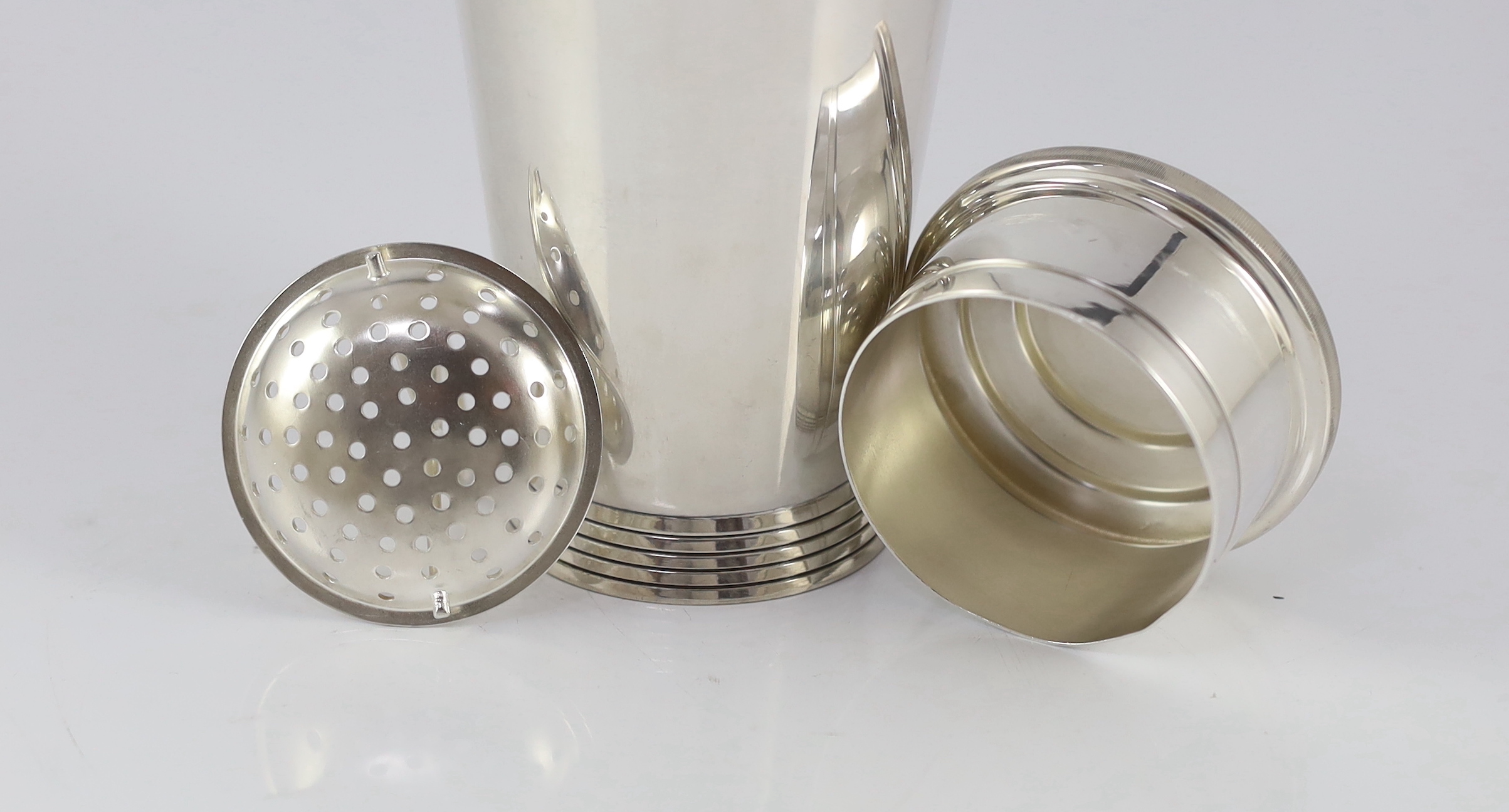 A 1930's Art Deco Mappin & Webb silver plated cocktail shaker designed by Keith Murray, numbered W28721